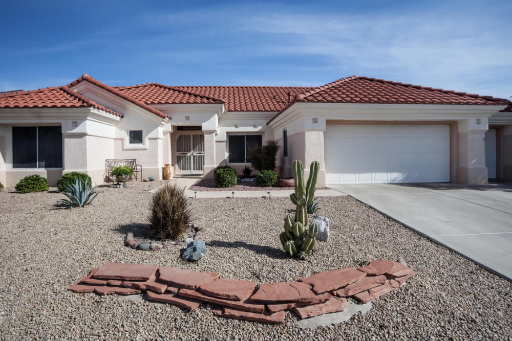 freshly painted Arizona home with rock garden