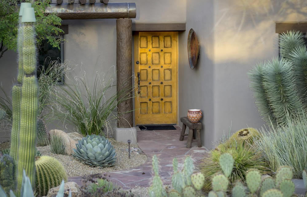 newly painted house with protected landscaping